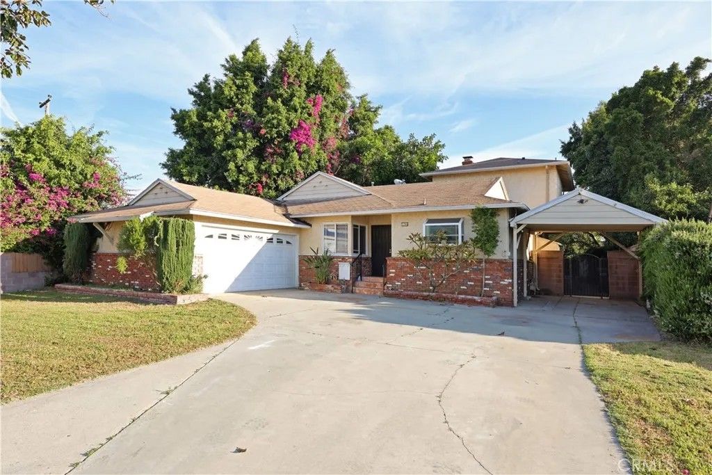 Photo of 7205 Glencliff Drive, Downey, CA 90240 (MLS # DW26064672)