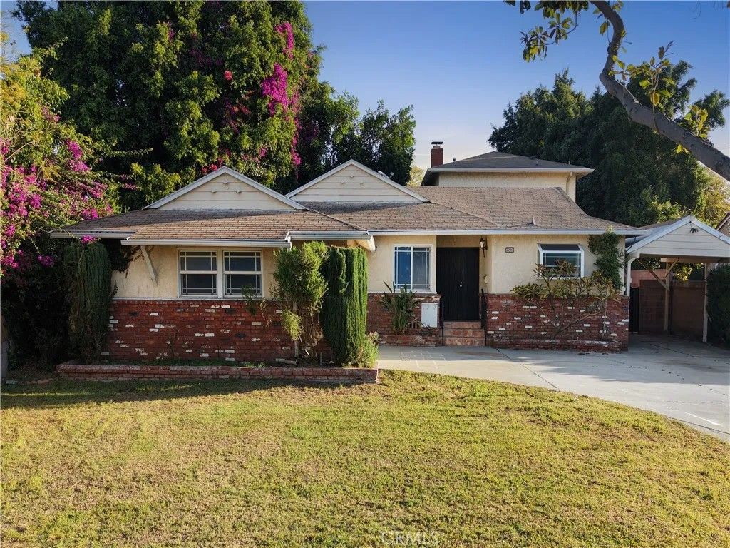 Photo of 7205 Glencliff Drive, Downey, CA 90240 (MLS # DW26064672)