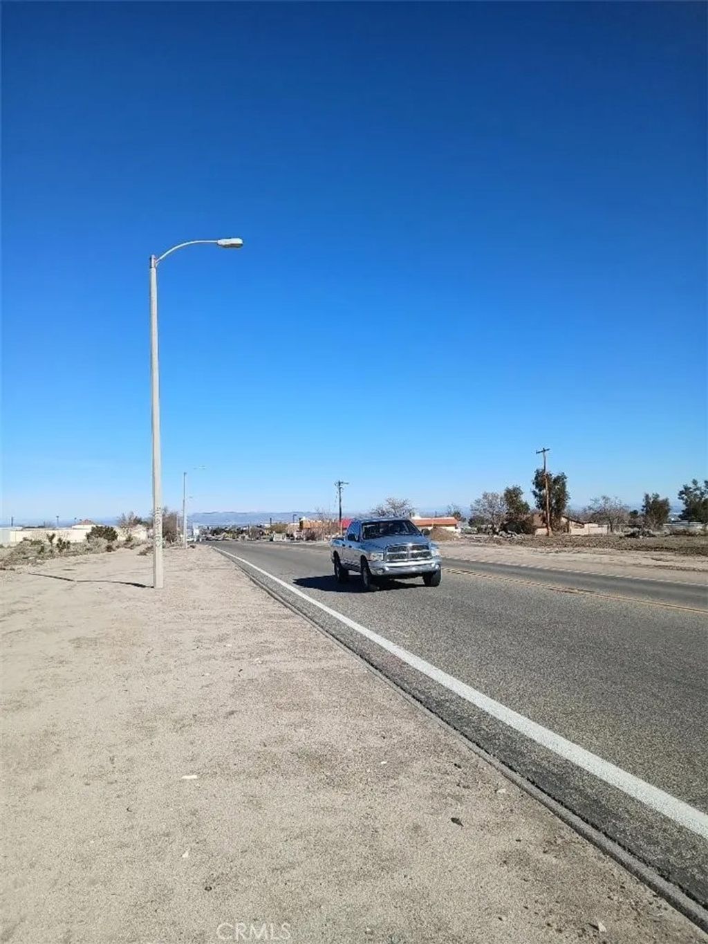 Photo of 957 El Mirage Rd, Adelanto, CA 92301 (MLS # HD26132918)