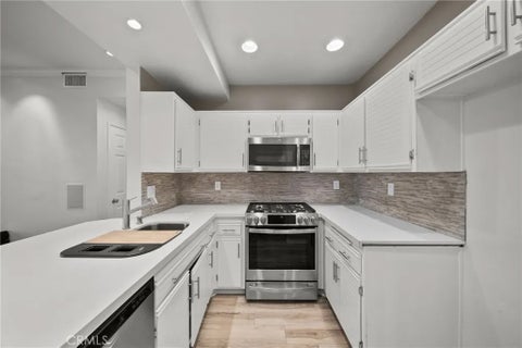 Photo of 24123 Del Monte Drive #101, Valencia, CA 91355 (MLS # SR26177047)