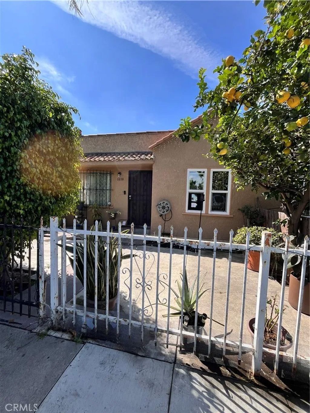 Photo of 1634 W Parade ST, Long Beach, CA 90810 (MLS # PW26103712)
