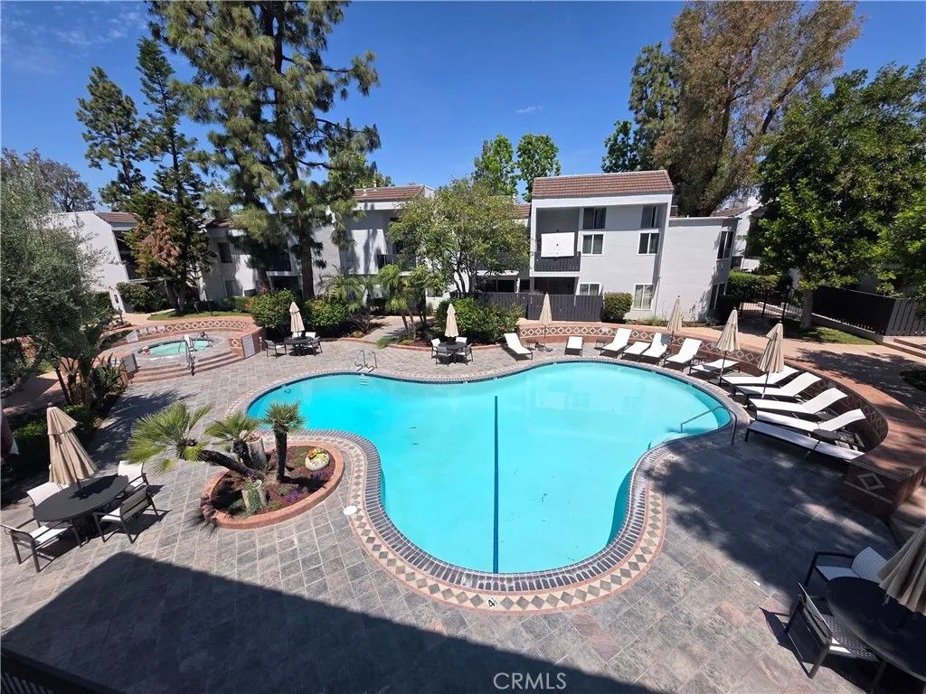 Photo of 18645 Hatteras St #111, Tarzana, CA 91356 (MLS # SR26091224)