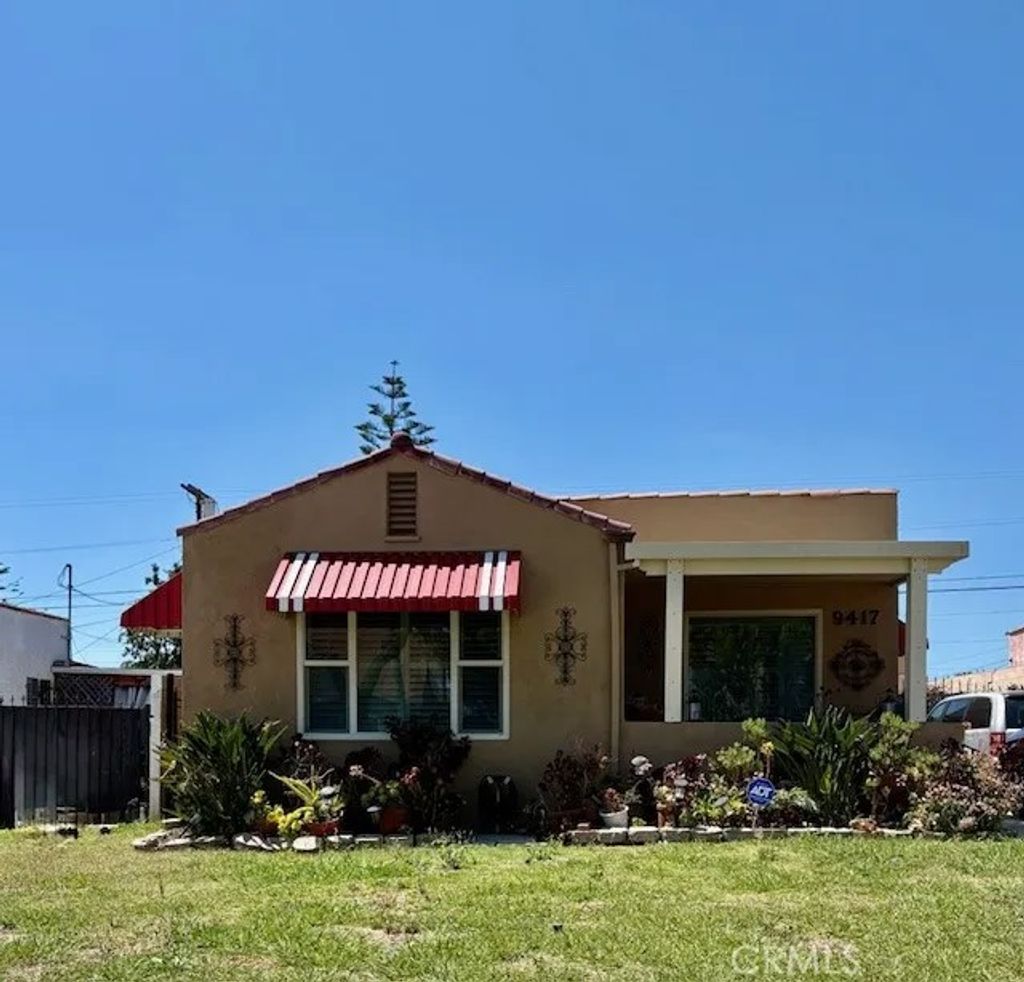 Photo of 9417 S Harvard Boulevard, Los Angeles, CA 90047 (MLS # SB26089417)