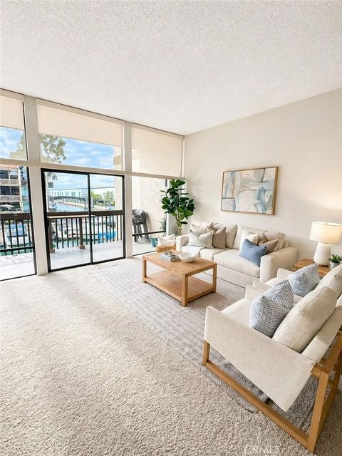 Photo of 9233 Marina Pacifica Dr, Long Beach, CA 90803 (MLS # PW26086260)