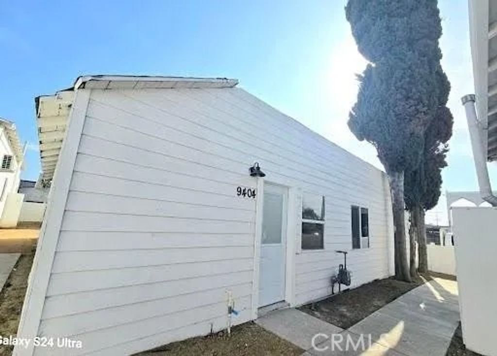 Photo of 1350 E 94th St, Los Angeles, CA 90002 (MLS # DW26089963)