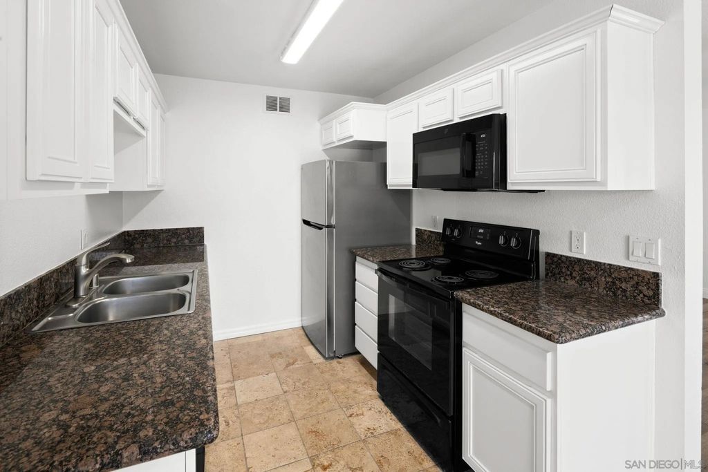 Photo of 7594 Park Ridge Blvd #13, San Diego, CA 92120 (MLS # 260001893)