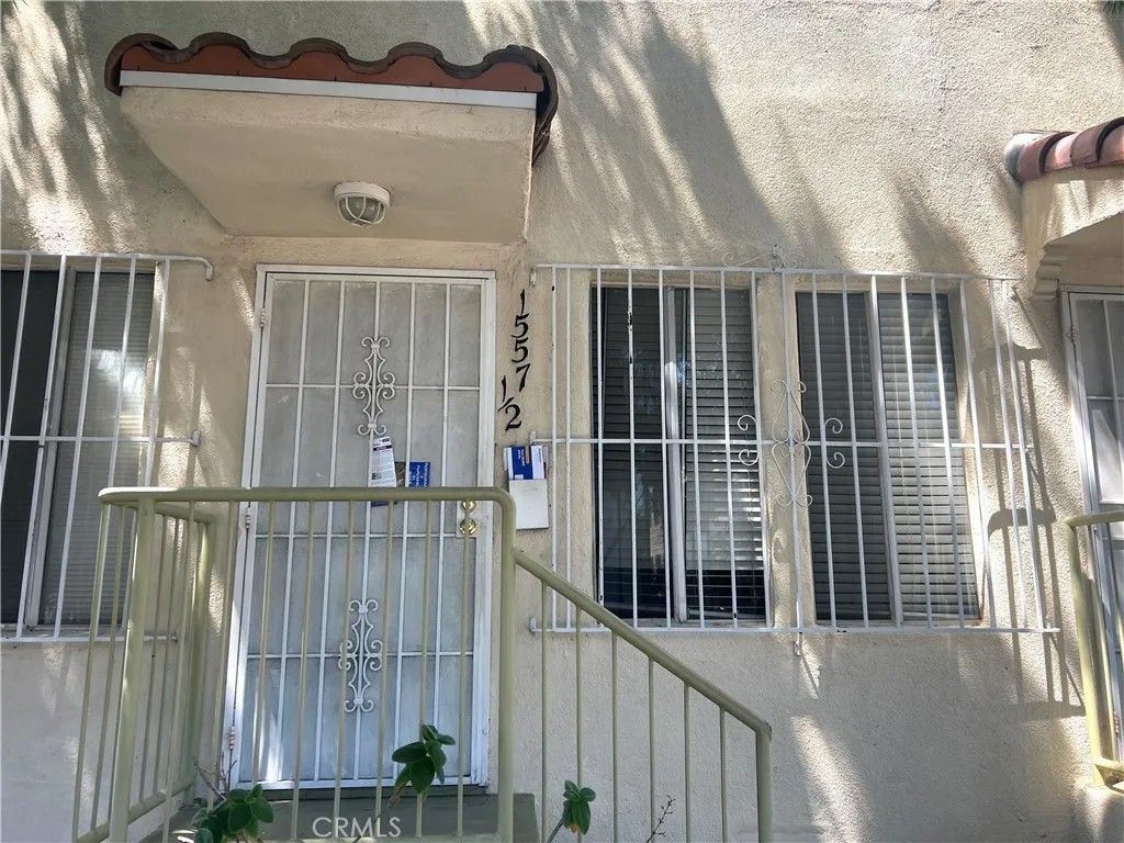 Photo of 1557 W 36th Place #1/2, Los Angeles, CA 90018 (MLS # SB26104765)
