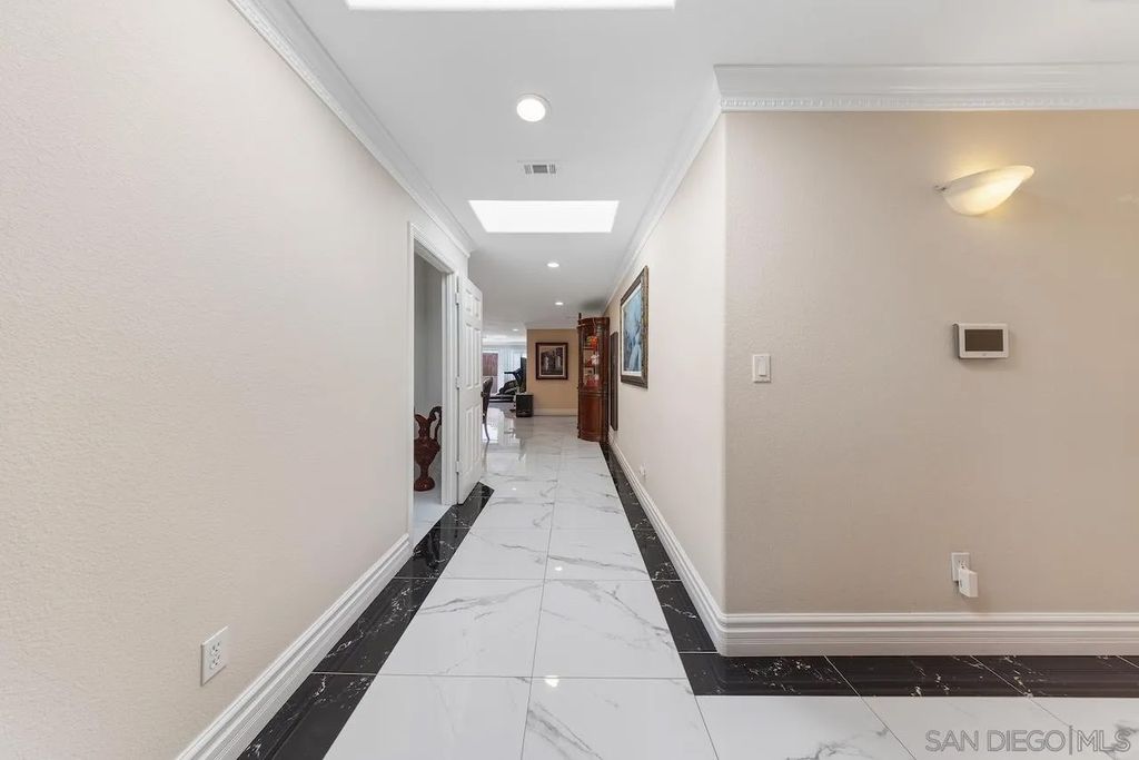 Photo of 5715 Castleton Dr, San Diego, CA 92117 (MLS # 250040885)
