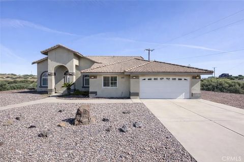 Photo of 7084 Aster Rd, Oak Hills, CA 92344 (MLS # CV26076611)