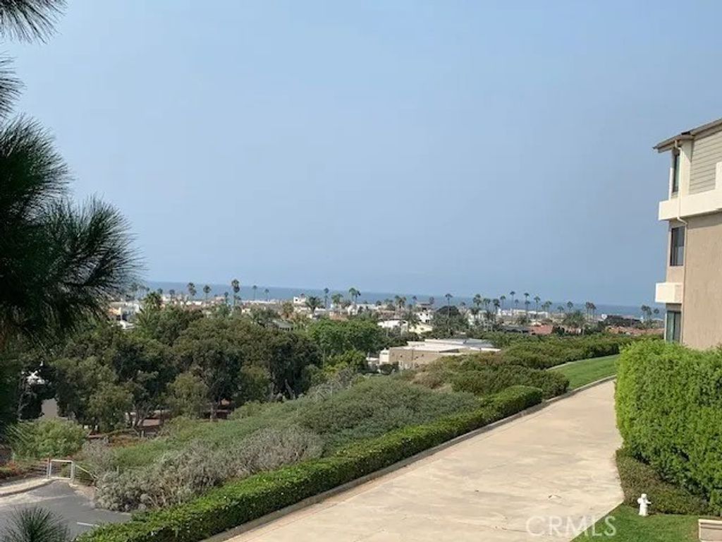 Photo of 280 Cagney Lane #215, Newport Beach, CA 92663 (MLS # OC25242231)