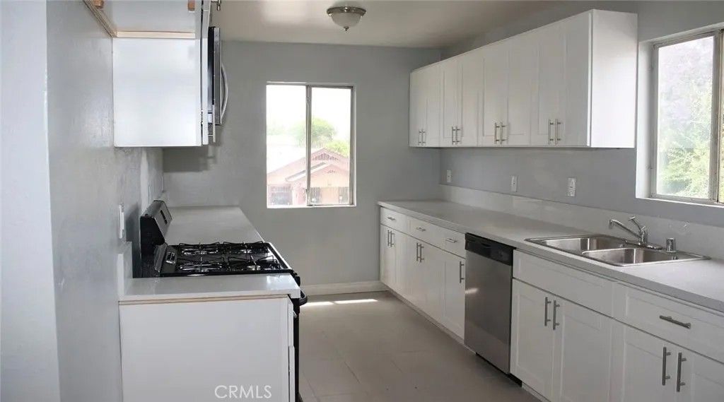 Photo of 1009 E Stockton Ave, Compton, CA 90221 (MLS # OC26064278)