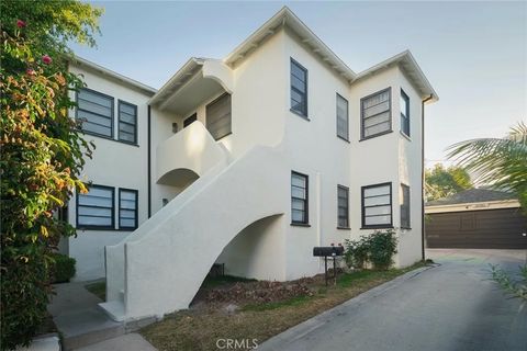 Photo of 1226 S Dunsmuir Ave, Los Angeles, CA 90019 (MLS # SB26035231)