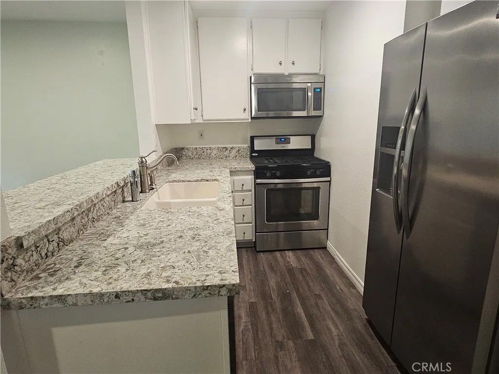 Photo of 7150 Carlson Circle #65, Canoga Park, CA 91303 (MLS # SR26019600)