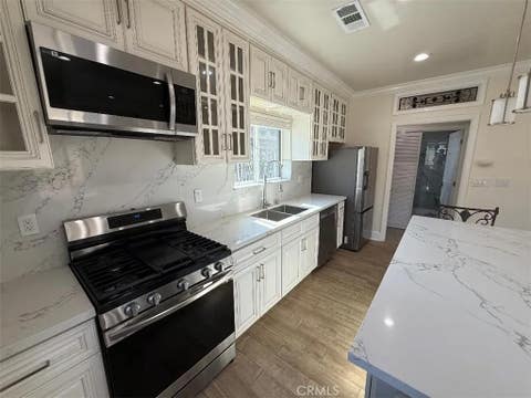 Photo of 3843 Weston Pl #A, Long Beach, CA 90807 (MLS # PW26177105)