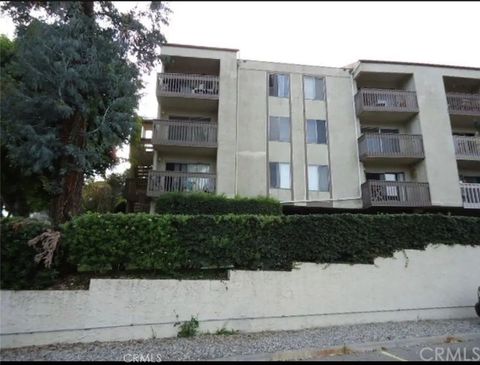 Photo of 1620 Neil Armstrong Street #203, Montebello, CA 90640 (MLS # SB26049513)