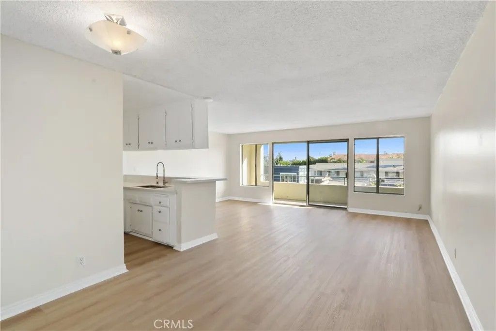 Photo of 1187 E 3rd Street #215, Long Beach, CA 90802 (MLS # PW26005933)