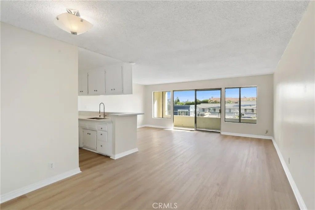 Photo of 1187 E 3rd Street #215, Long Beach, CA 90802 (MLS # PW26005933)