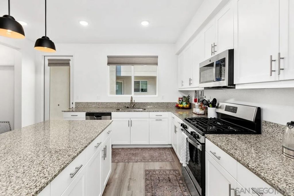 Photo of 5405 Beach Bluff Ln #224, San Diego, CA 92154 (MLS # 250044279)