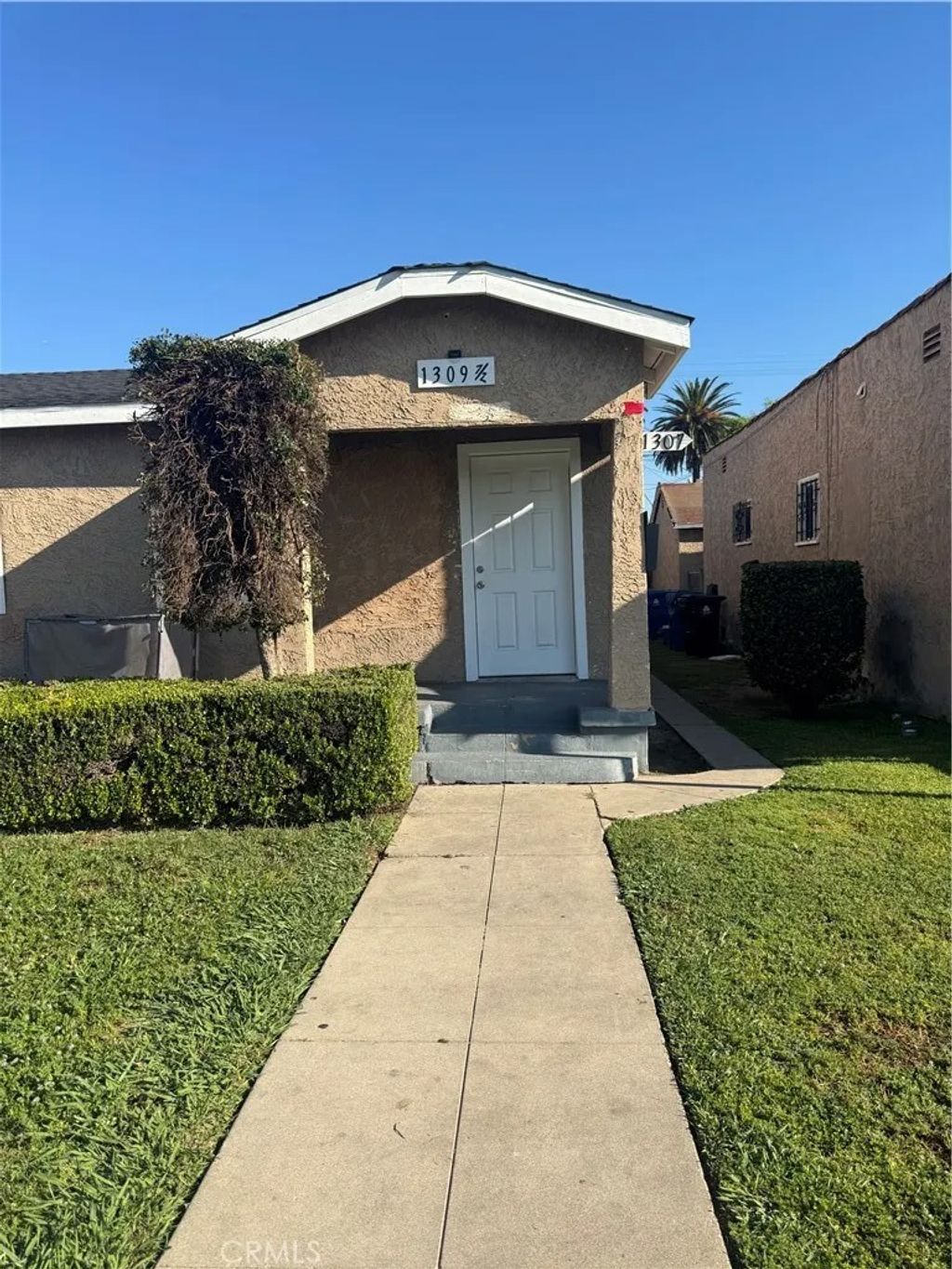 Photo of 1309 W 62nd St, Los Angeles, CA 90044 (MLS # SR26060845)