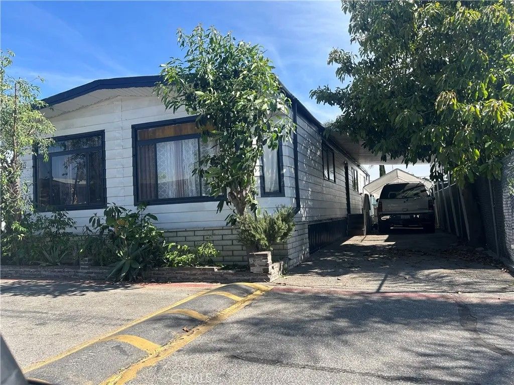 Photo of 1401 W 9th St #148, Pomona, CA 91766 (MLS # CV26086508)