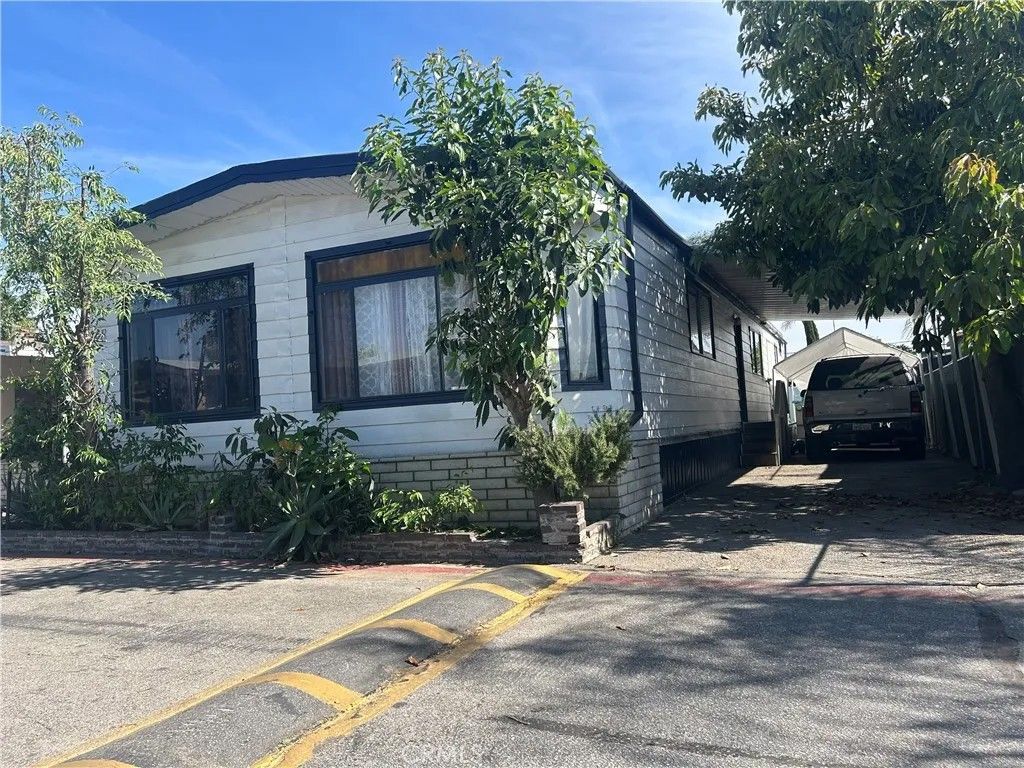Photo of 1401 W 9th St #148, Pomona, CA 91766 (MLS # CV26086508)