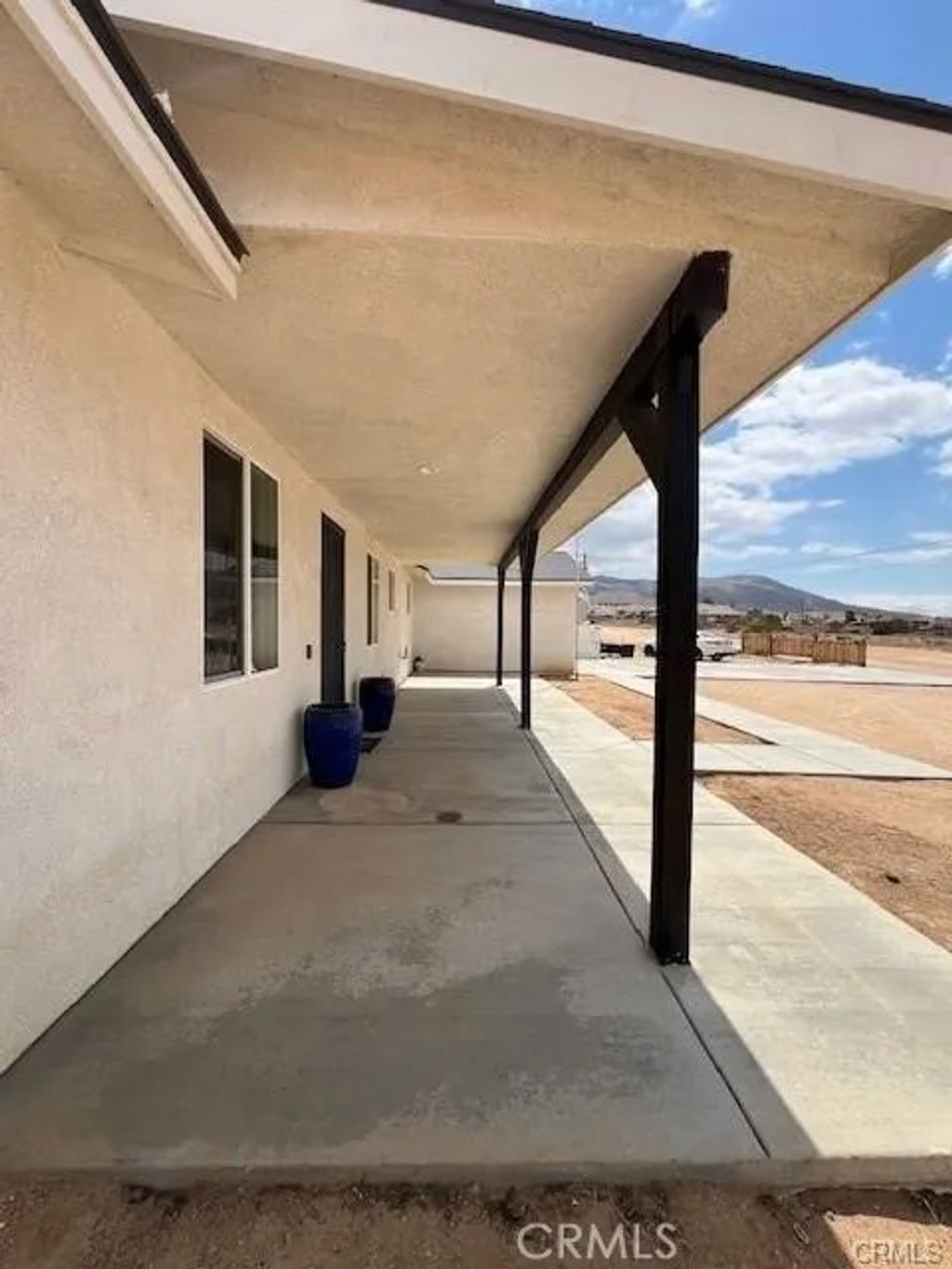 Photo of 10773 Mills Road, Apple Valley, CA 92308 (MLS # HD25281568)