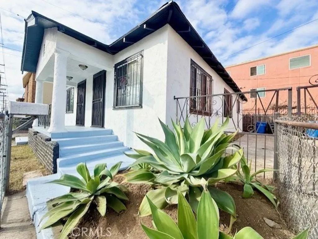 Photo of 2411 Griffith Avenue, Los Angeles, CA 90011 (MLS # MB26008636)