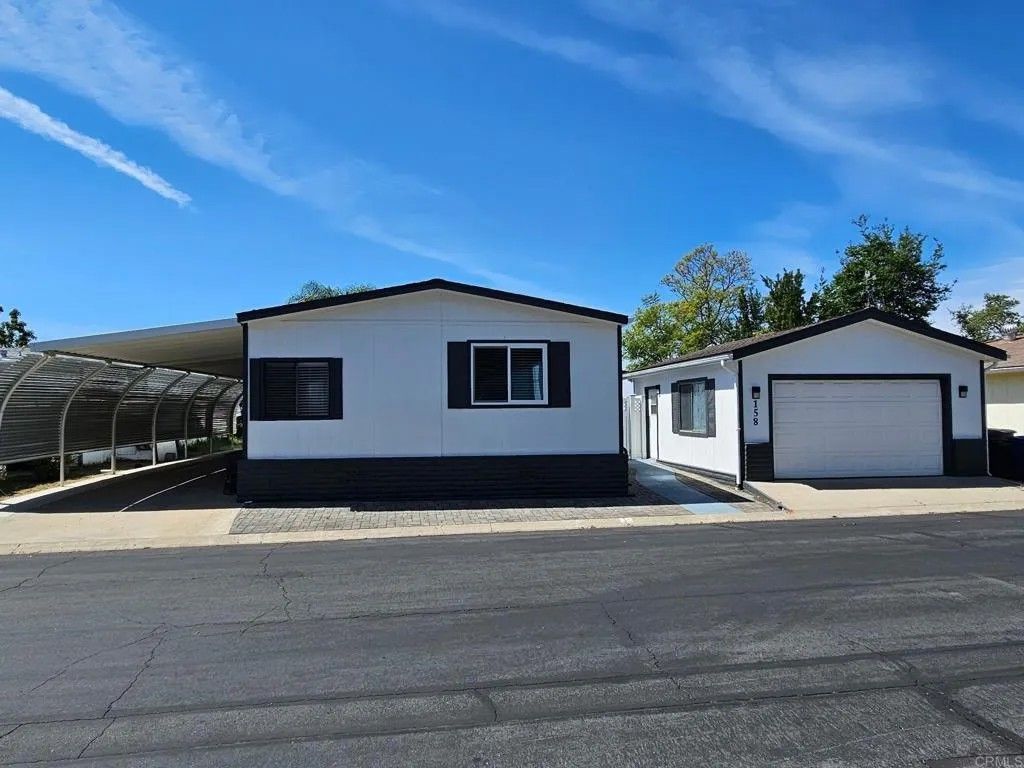 Photo of 18218 Paradise Mountain #SPC 158, Valley Center, CA 92082 (MLS # NDP2603370)