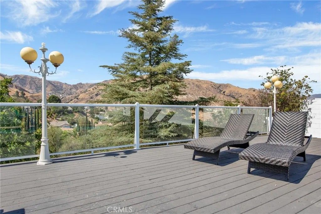 Photo of 12036 Darby Avenue, Porter Ranch, CA 91326 (MLS # SW26008893)