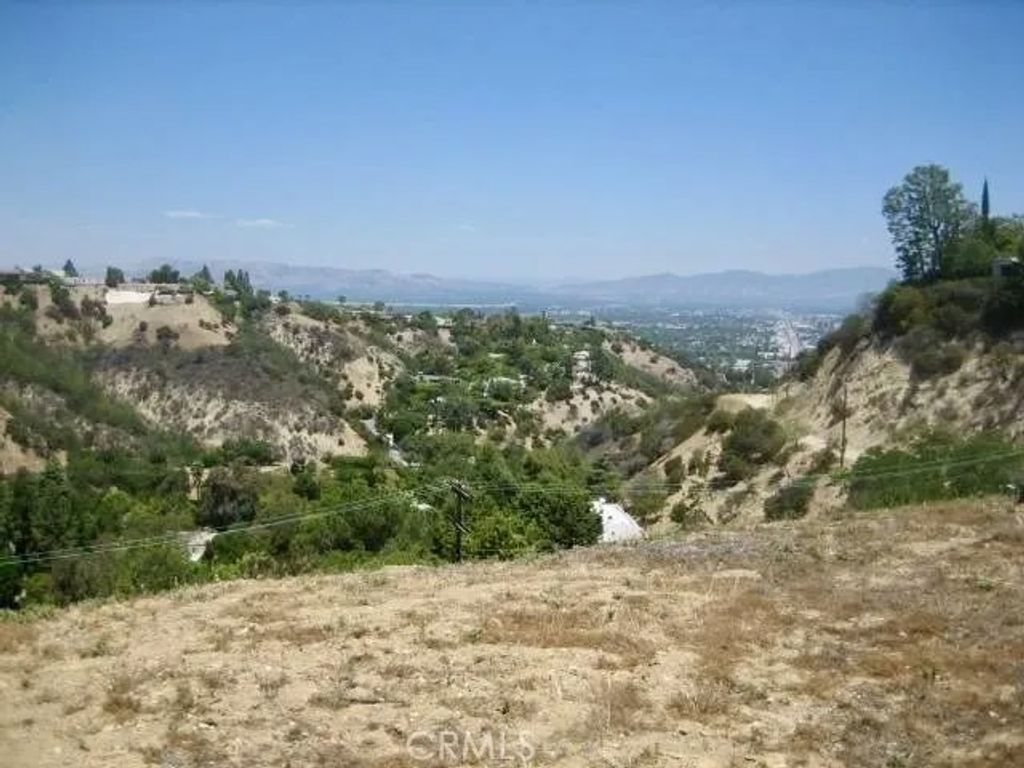 Photo of 3511 Beverly Glen, Los Angeles, CA 91423 (MLS # OC26005730)