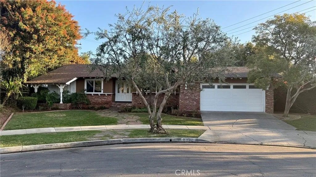 Photo of 12972 Woodlawn Avenue, Tustin, CA 92780 (MLS # PW25272141)