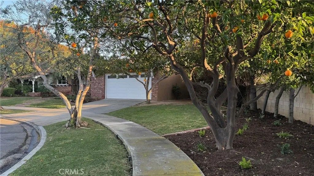 Photo of 12972 Woodlawn Avenue, Tustin, CA 92780 (MLS # PW25272141)