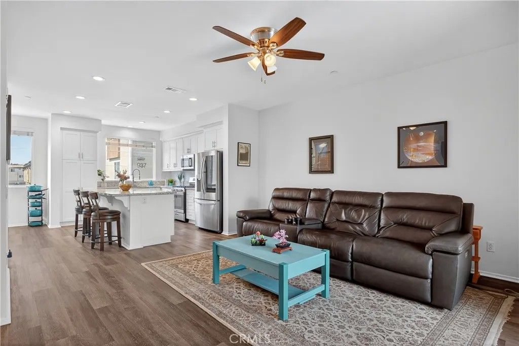 Photo of 893 Tangelo Way #103, Corona, CA 92878 (MLS # IG25198943)