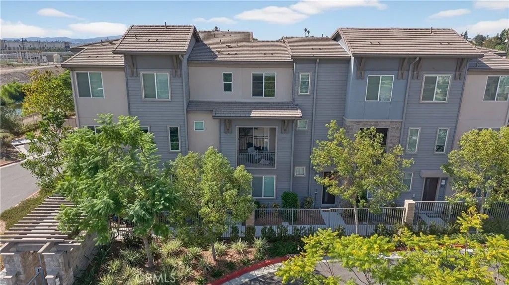 Photo of 893 Tangelo Way #103, Corona, CA 92878 (MLS # IG25198943)