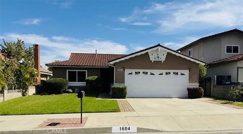Photo of 1604 N Greycastle Avenue, Montebello, CA 90640 (MLS # DW26070568)