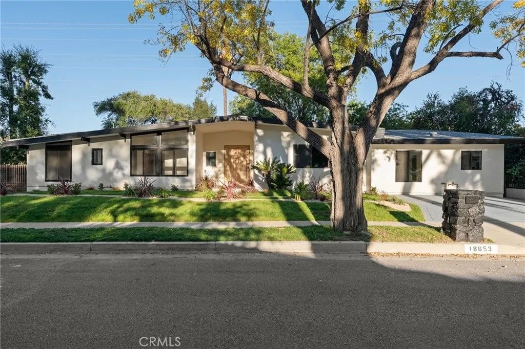 Photo of 18653 Palomino Drive, Tarzana, CA 91356 (MLS # SR25267985)