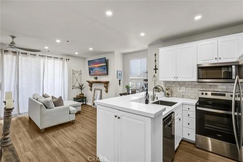 Photo of 20301 Bluffside Cir #D313, Huntington Beach, CA 92646 (MLS # OC26035011)