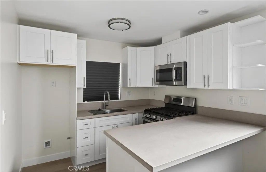 Photo of 2115 W 29th St #A, Long Beach, CA 90810 (MLS # SB26003424)