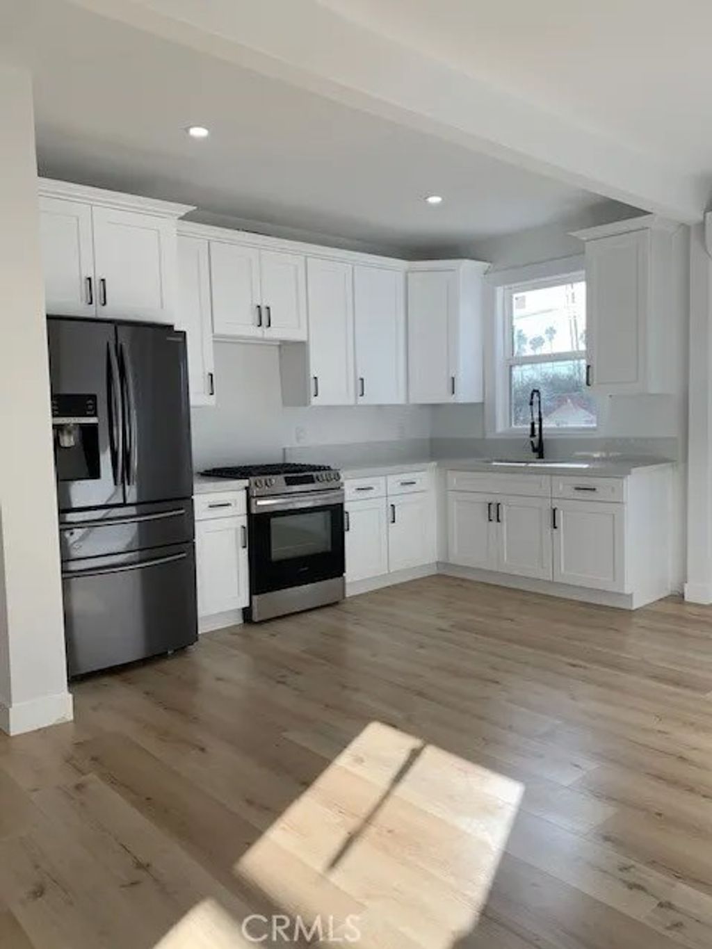 Photo of 247 N New Hampshire Ave, Los Angeles, CA 90004 (MLS # SR26045268)