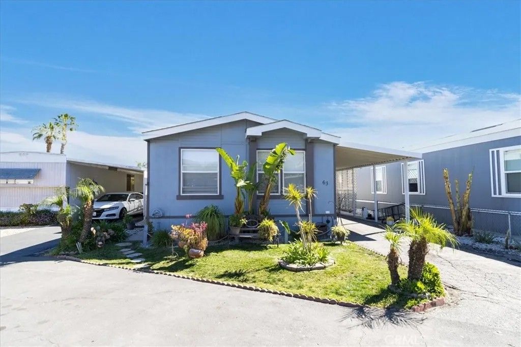 Photo of 32900 Riverside Dr #63, Lake Elsinore, CA 92530 (MLS # SW26044837)