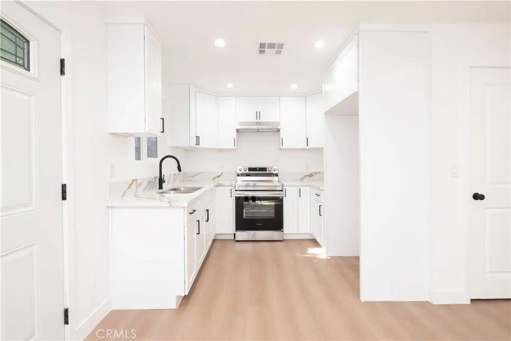 Photo of 5739 S St Andrews Pl, Los Angeles, CA 90062 (MLS # DW25267436)