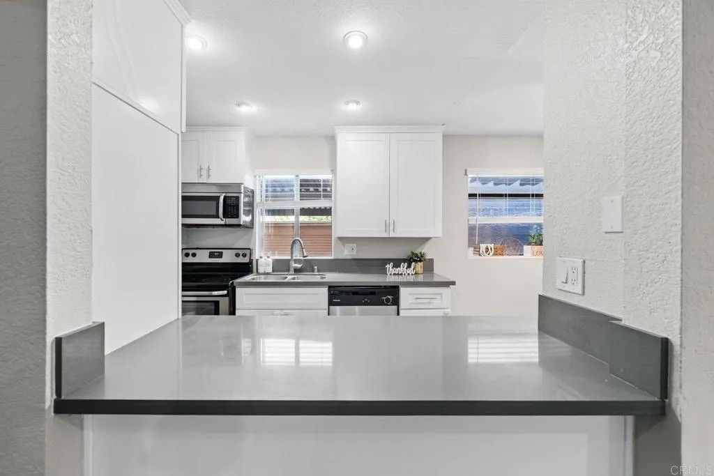 Photo of 3140 Midway Drive #A107, San Diego, CA 92110 (MLS # PTP2601189)