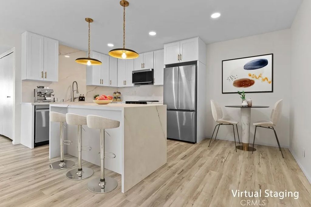 Photo of 21921 Rimhurst Dr #128-F, Lake Forest, CA 92630 (MLS # OC25266401)