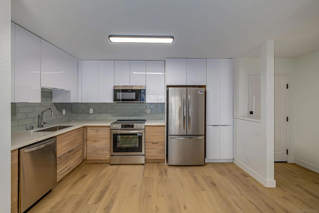 Photo of 3020 Cowley Way #104, San Diego, CA 92117 (MLS # 260008061)