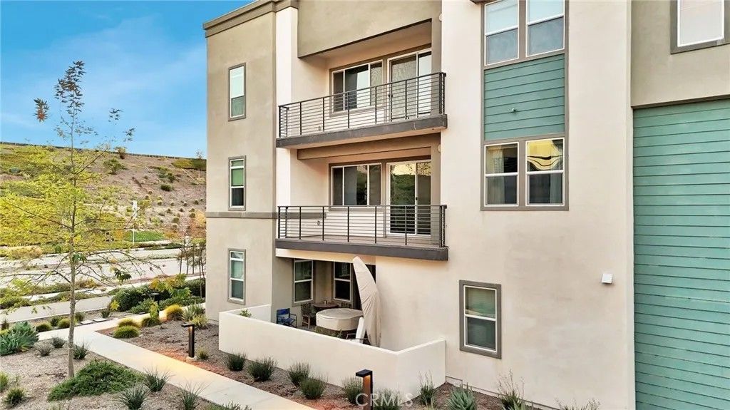 Photo of 26958 Sandbar Willow Pl #205, Valencia, CA 91355 (MLS # SR26046621)