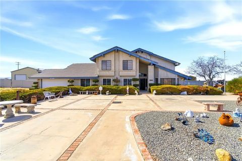 Photo of 11468 Kiowa Rd, Apple Valley, CA 92308 (MLS # CV26029840)