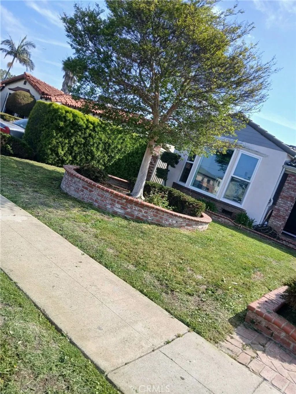 Photo of 10038 S St Andrews Pl, Los Angeles, CA 90047 (MLS # IN25252375)