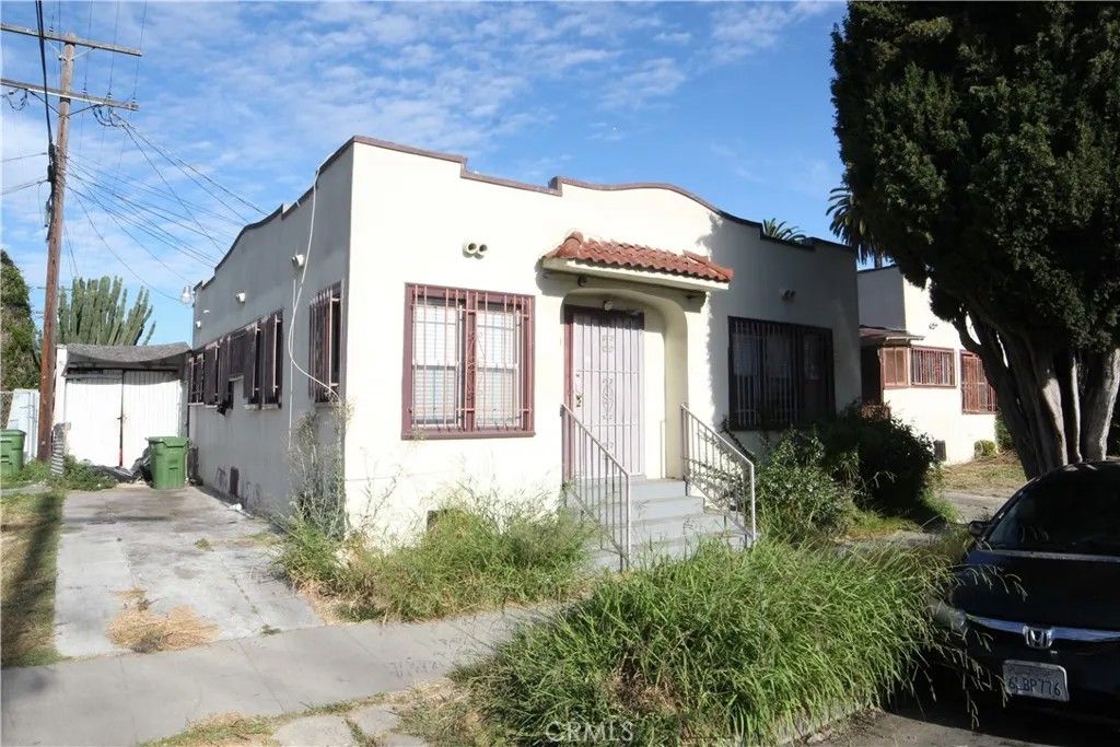 Photo of 3959 S St Andrews PL, Los Angeles, CA 90062 (MLS # PW26097481)
