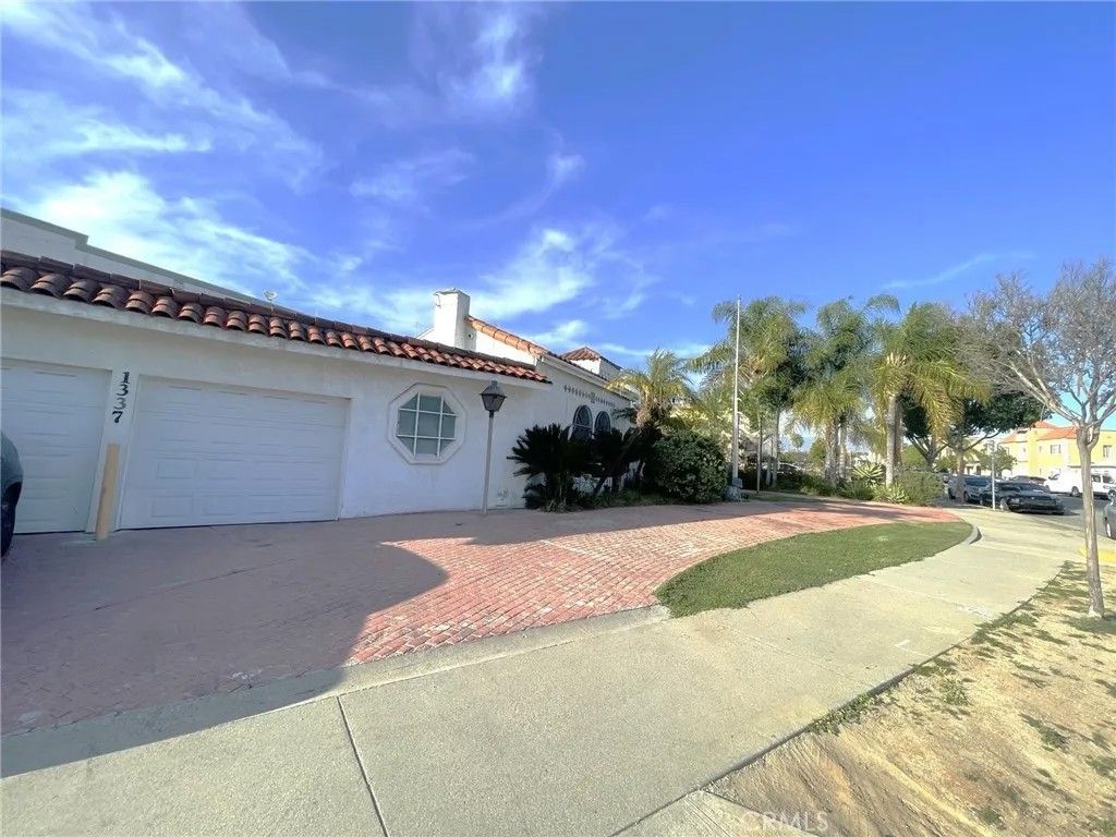 Photo of 1335 S Woods Pl, Los Angeles, CA 90022 (MLS # RS26039270)