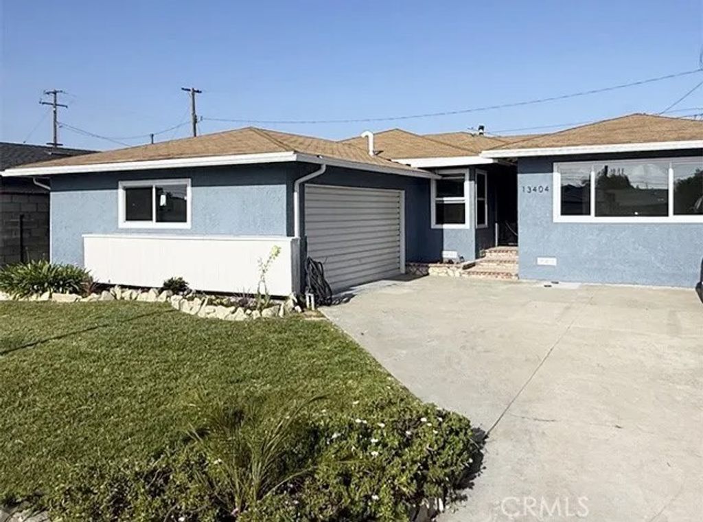 Photo of 13404 Purche Ave, Gardena, CA 90249 (MLS # SR26095424)